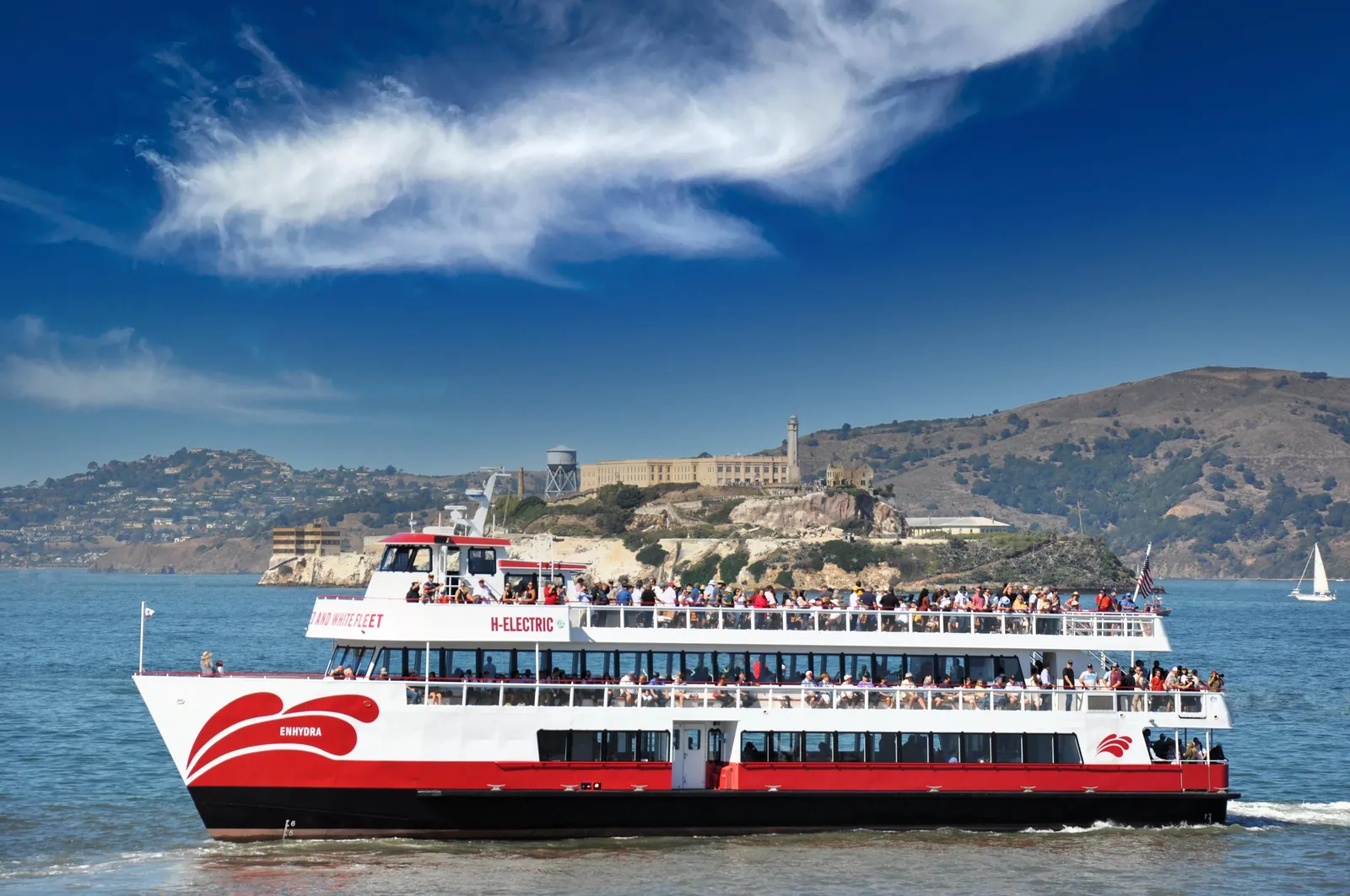 A Red and White Fleet boat on San Francisco Bay with Alcatraz behind