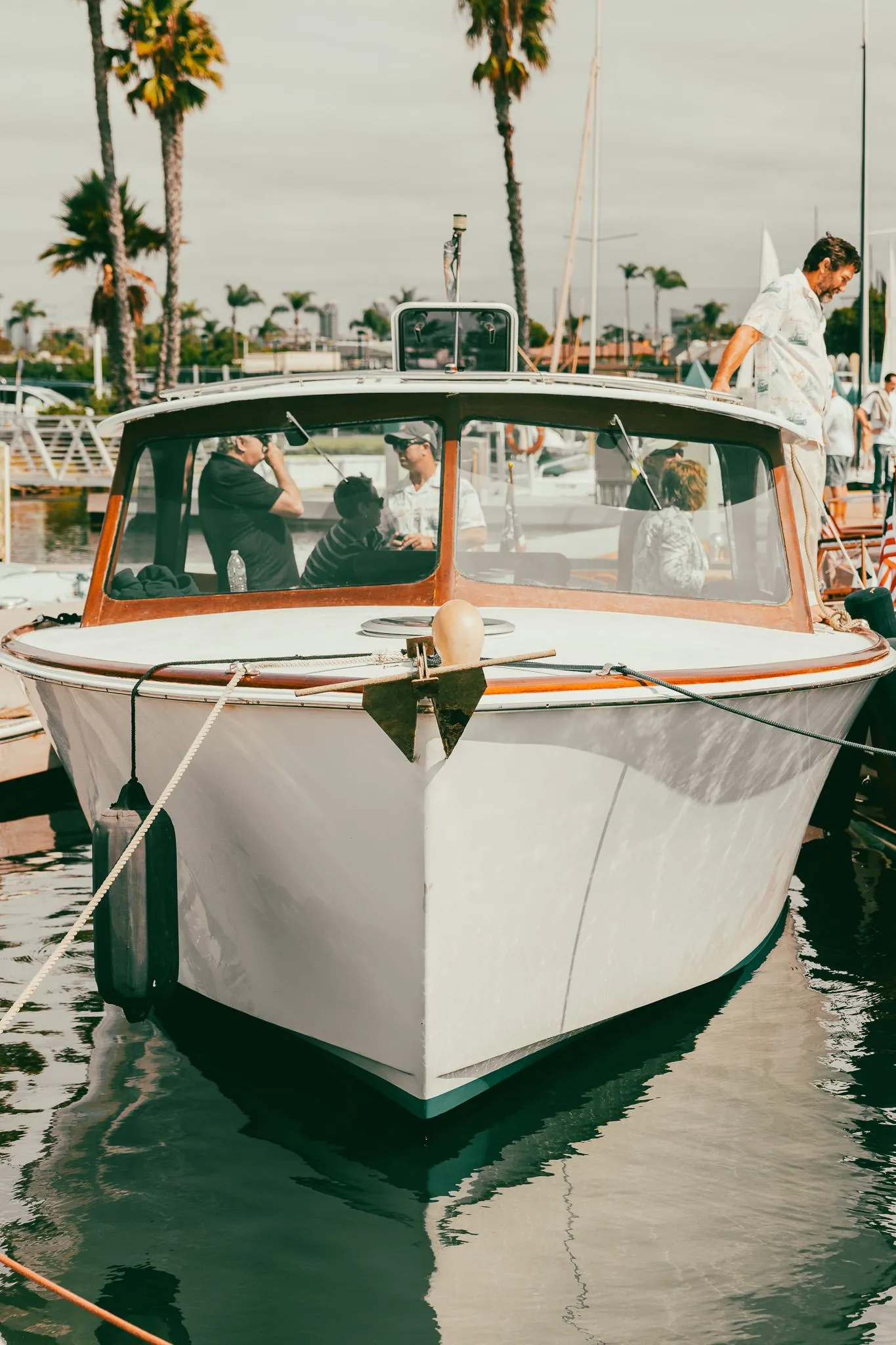 A classic wooden cruiser moored at a San Diego marina