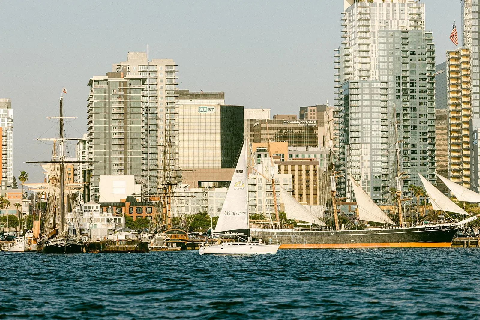A sailboat on San Diego Bay below the downtown towers
